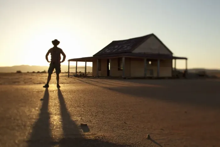 Framed Print : man in front of outback shed