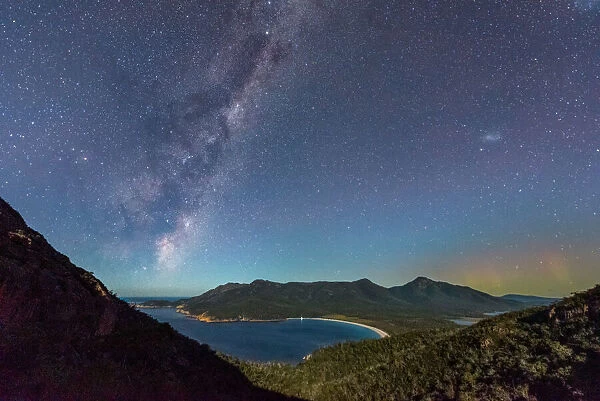Milky Way and Aurora over a moonlit Wineglass Bay