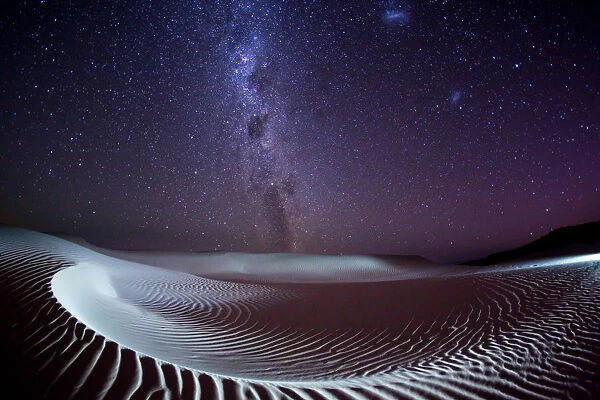 Milky Way and stars over a sand dune. Australia