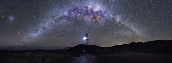 Milkyway arching over lighthouse