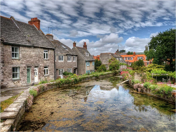 A mill-pond and historic cottages at Swanage, Dorset, England, United Kingdom