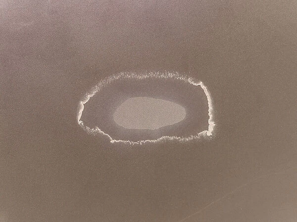Minimal drone image looking down on an oval shaped salt formation, Wyndham, Western Australia, Australia