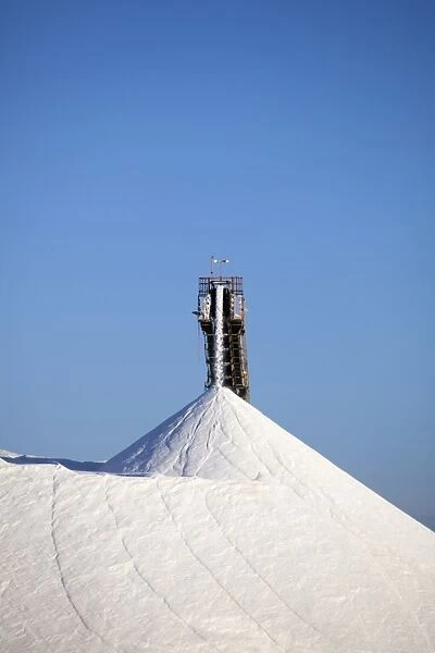 Mining machinery unloading salt at a salt mine