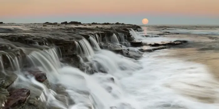 Framed Print : Moon rising over seascape waterfall