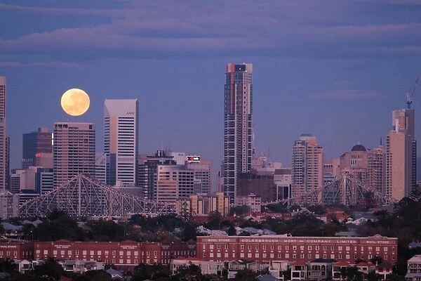 Moondance. As the Full moon sets over the city of Brisbane