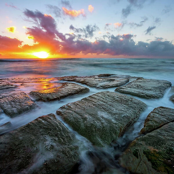 Morning. Sunrise on the rocks