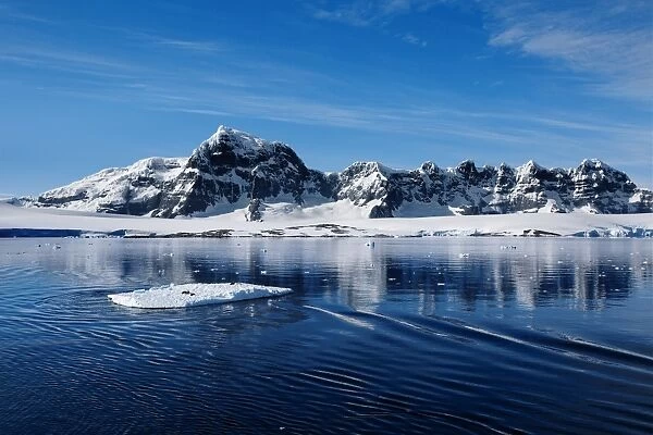 Mountain Range Along Danco Coast With a Floating Ice in the Foreground, West Coast Of The Antarctic Peninsula, Antarctica