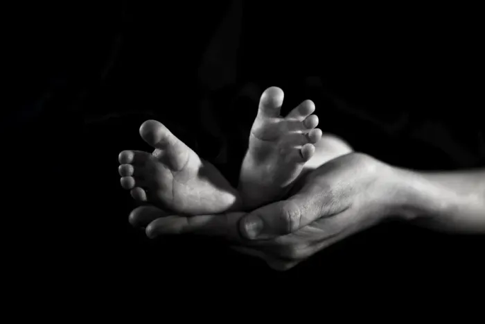 Framed Print : New born feet and mothers hands