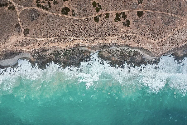 Ocean waves crashing into the Bunda Cliffs photographed from a drone point of view, Nullarbor, South Australia, Australia