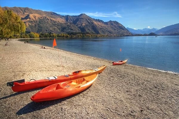 Orange boats on beach at Lake Wanaka