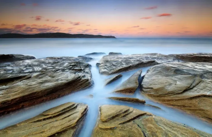 Framed Print : Pastel sunset over rock platform