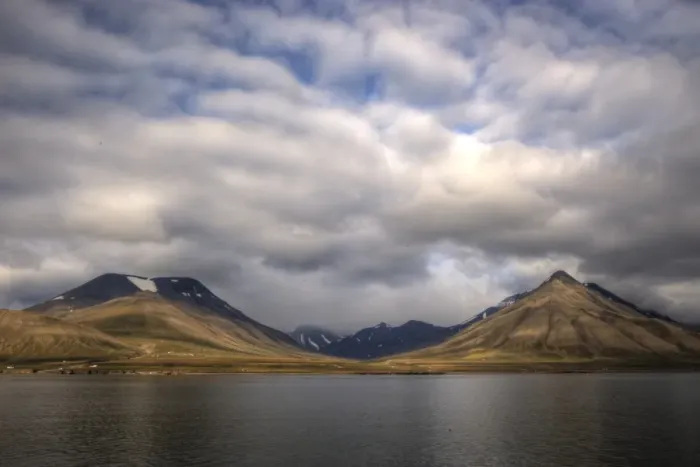 Framed Print : Picturesque Svalbard coastline fjord and mountains