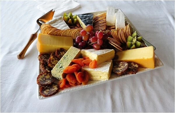 A platter of local King Island produce. Soft and hard cheeses produced in the Cheese factory at Porkies Creek. Bass Strait, Tasmania