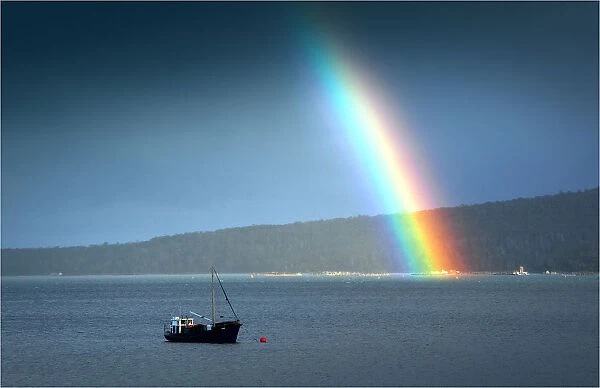 Rainbow during a storm at Dover, in the southern area of the island state, Tasmania, Australia