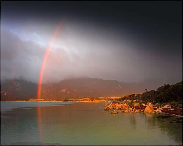 A rainbow after a storm at Fotheringate beach, Flinders Island, Bass Strait, Tasmania, Australia