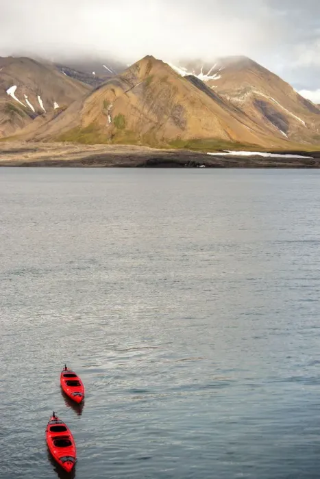 Framed Print : Red kayaks and Svalbard summer mountains Framed Print : Red kayaks and Svalbard summer mountains