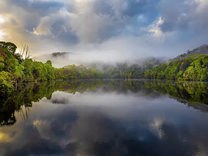 Framed Print : Reflected light over the Pieman river in the Tarkine wilderness area on the west coast of Tasmania Framed Print : Reflected light over the Pieman river in the Tarkine wilderness area on the west coast of Tasmania