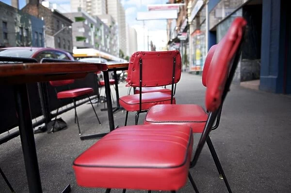 Retro red vinyl chairs on inner-city street