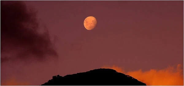 Rising moon over the Strzelecki range on Flinders Island, Bass Strait, Tasmania, Australia