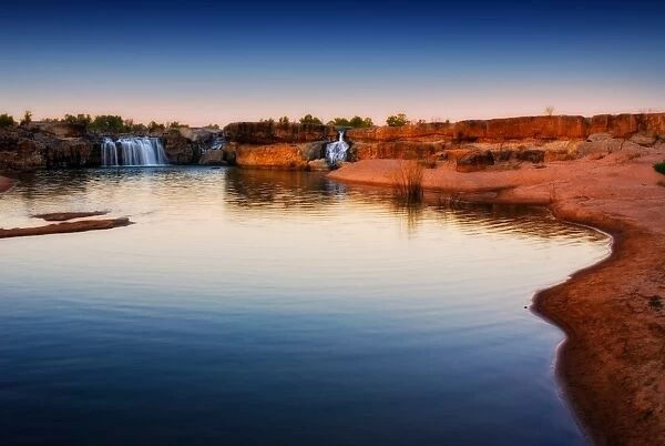 River waterfalls with red earth