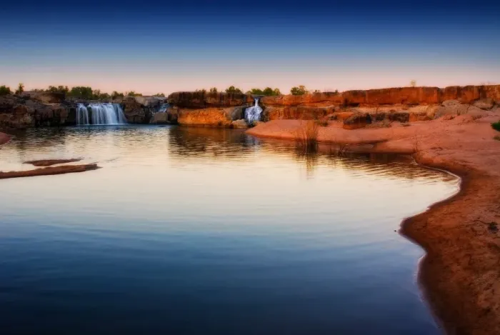 Framed Print : River waterfalls with red earth