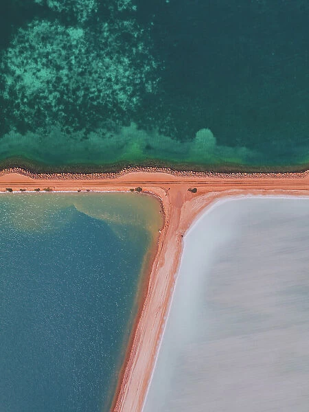 Salt storage ponds by the ocean as seen from above, Western Australia