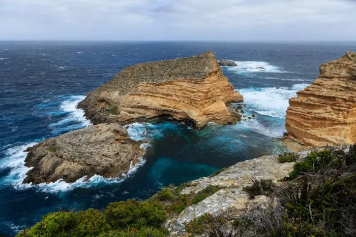 Framed Print : Sandstone outcrops off the coast at Cape Wiles Framed Print : Sandstone outcrops off the coast at Cape Wiles