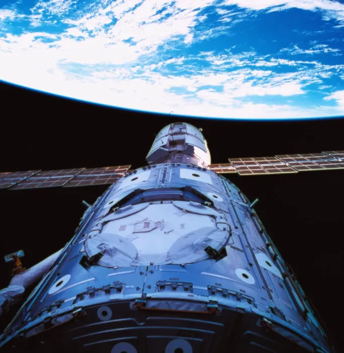 Framed Print : A satellite orbiting above earth