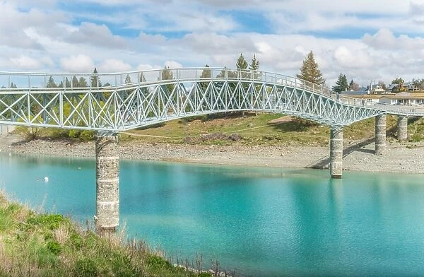 Scenery view of Lake Tekapo footbridge across the stunning water of lake Tekapo in South Island, New Zealand