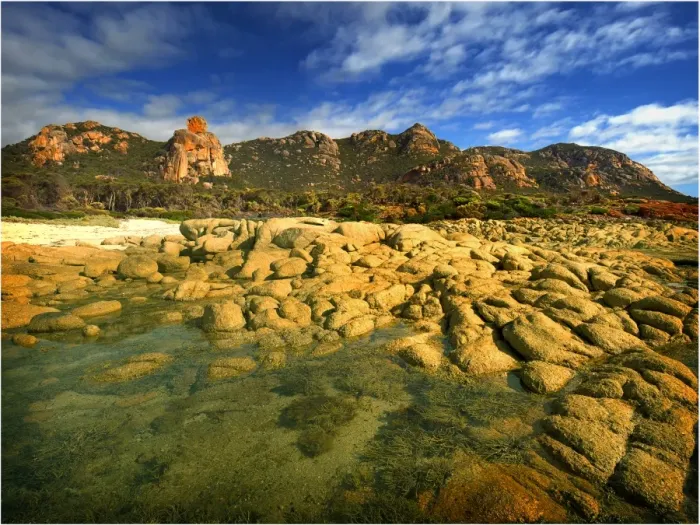 Framed Print : A scenic view at the Docks, a colourful area of coastline on Flinders Island, part of the Furneaux group, eastern Bass Strait, Tasmania