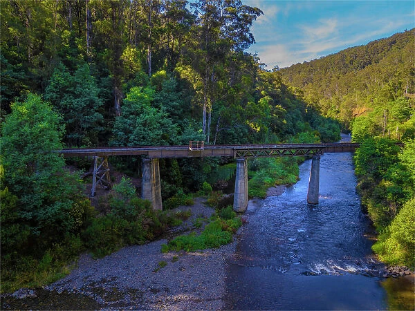 A scenic view of the Thomson river and historic railway bridge, Central Gippsland