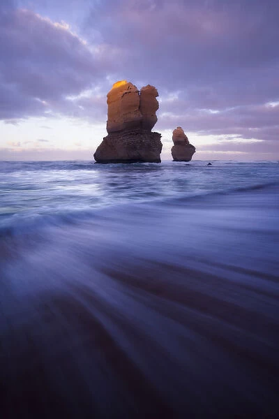 Two sea stacks at Gibsons Steps and a receding wave, Great Ocean Road, Victoria, Australia