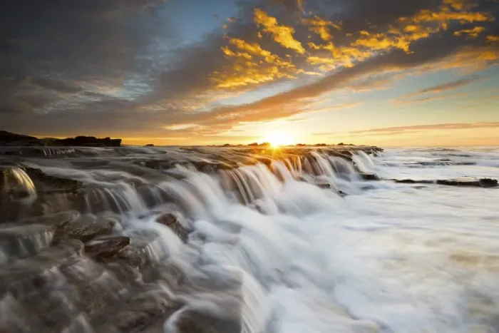 Framed Print : Seascape waterfall with sun star