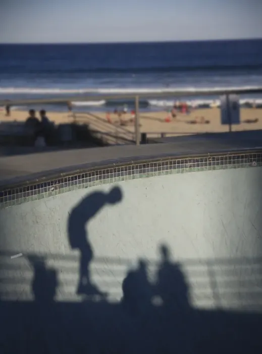 Framed Print : Shadow of skater with beach in background Framed Print : Shadow of skater with beach in background