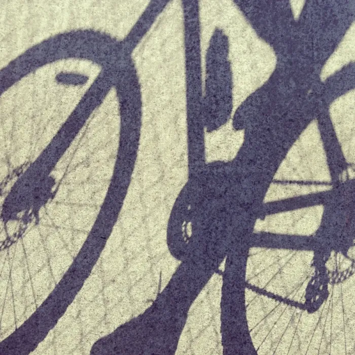 Framed Print : Shadows on concrete of person riding on a bicycle