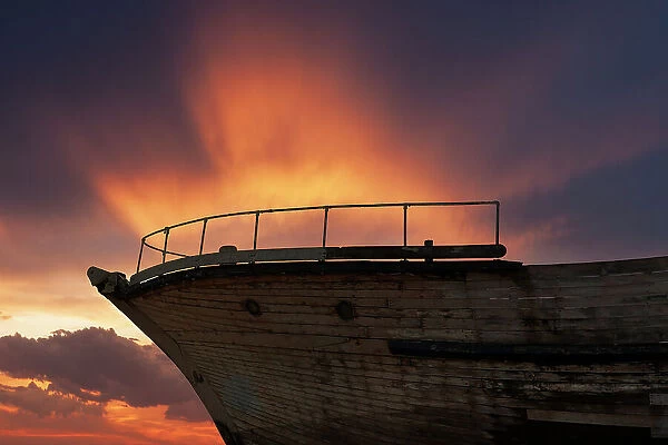 Ship Ahoy. Composite image of a dramatic fiery sky at dusk against part
