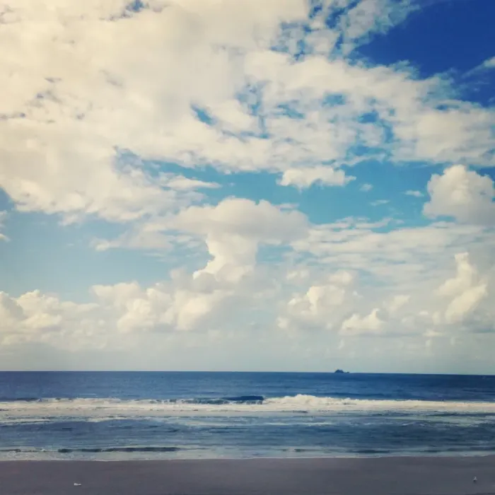 Framed Print : Small island on the horizon of the ocean