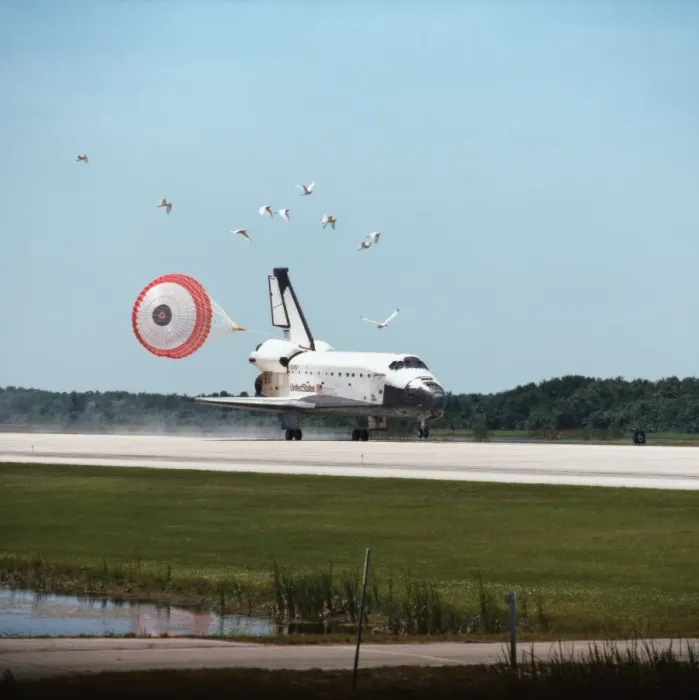 Framed Print : The space shuttle landing with its drogue parachute deployed Framed Print : The space shuttle landing with its drogue parachute deployed
