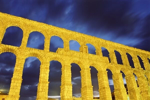 Spain, Castilla y Leon, Segovia, Roman aqueduct, low angle view