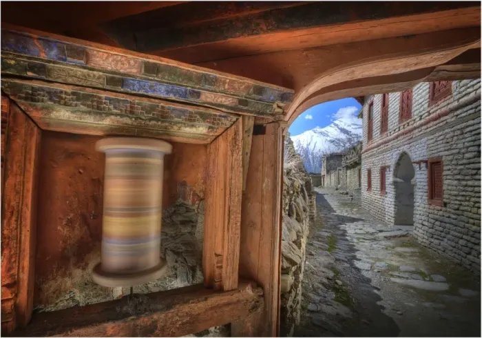 Framed Print : A spinning Prayer wheel used in worship, in the high mountain village of Tukuch, Mustang, Western Himalayas, Nepal