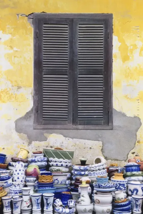 Framed Print : Stacks of Pottery by Window