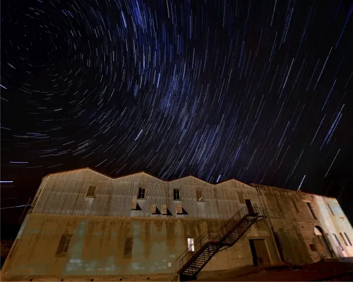 Framed Print : Star-trails appearing over an old warehouse, Oamaru, South Island, New Zealand