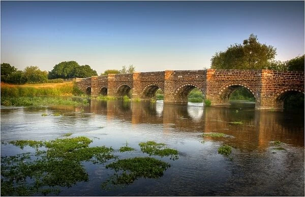 The Stour river and historic bridge at Sturminster Marshall, Dorset, England, United Kingdom