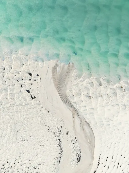 Framed Print : Stream of water flowing across a sandbar into Willie Creek estuary, Western Australia, Australia