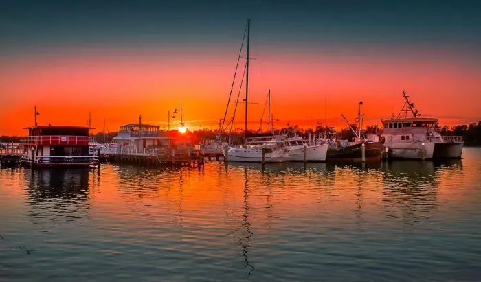 Framed Print : A summer dawn light castes a glow over the boats and harbour area at Lakes Entrance, East Gippsland