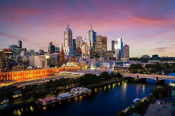 Sunset over city skyline of Melbourne downtown, Princess Bridge