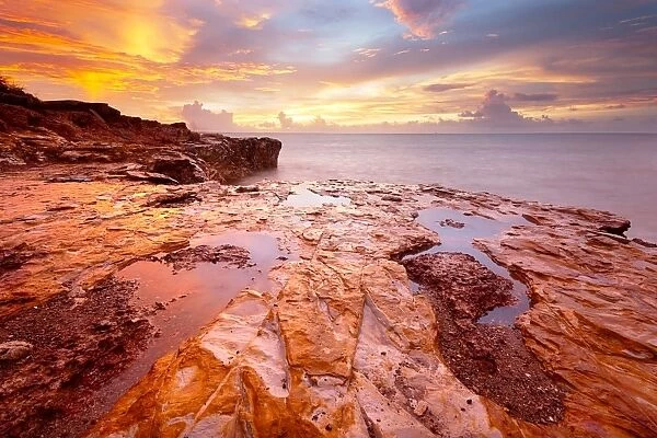 Gold. Sunset from East Point Darwin, over the bright red cliffs