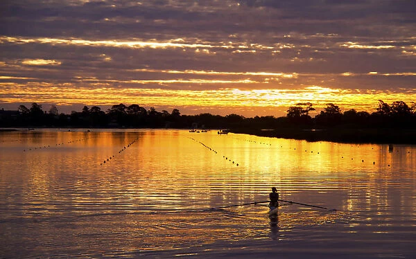 Sunset reflections with rower on Lake Wendouree Ballarat, Victoria, Australia