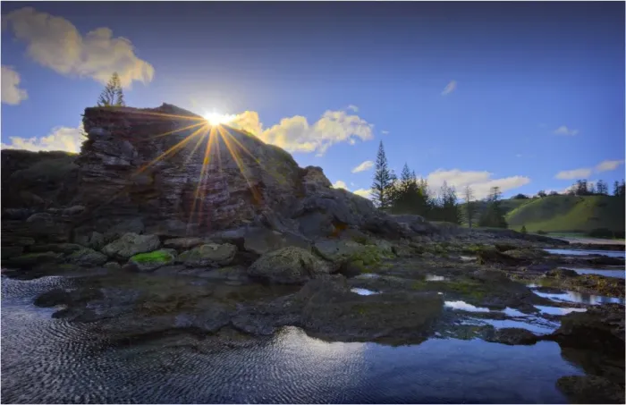 Framed Print : Sunstar at Cemetery bay