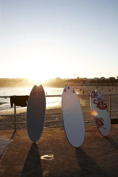 Surfboards leaning against railing